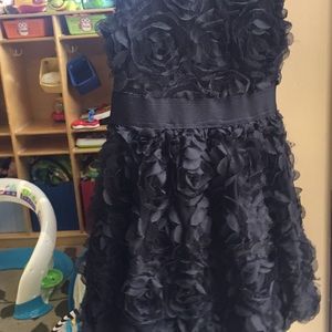 Girls little black dress rosette style